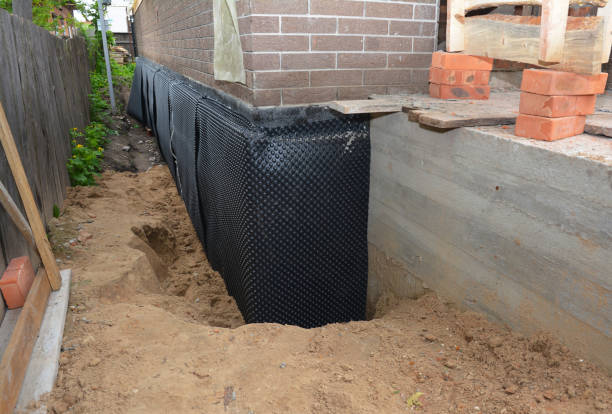 SJ Waterproofing Pros technician performing targeted Basement Waterproofing assessment in Cornersville, TN